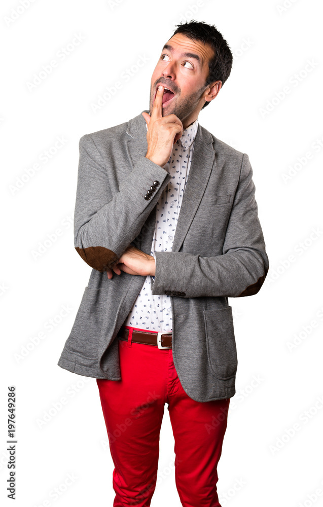 Handsome man making surprise gesture on isolated background Handsome man making surprise gesture on isolated background