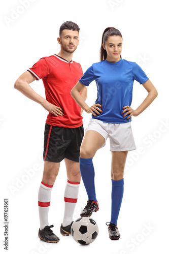 Male and a female soccer player with a football