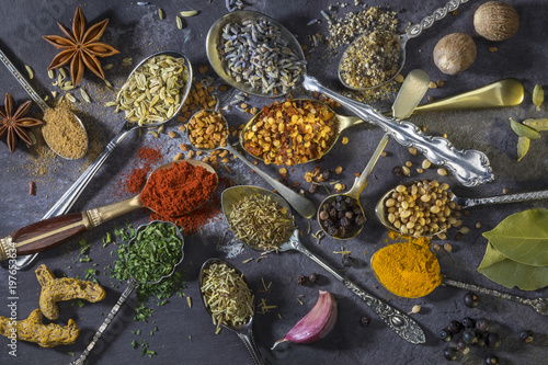 Fototapeta Naklejka Na Ścianę i Meble -  Spices on spoons - used to add flavor to cooking