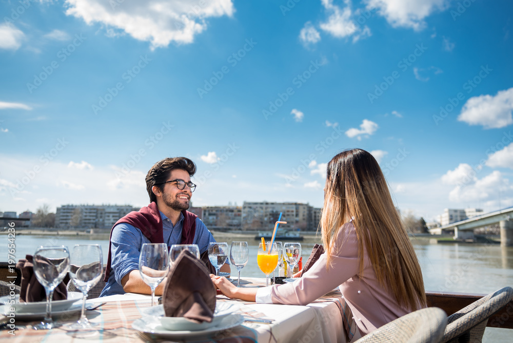 Young love couple on a romantic date at a cafe. Outdoors, love, romance