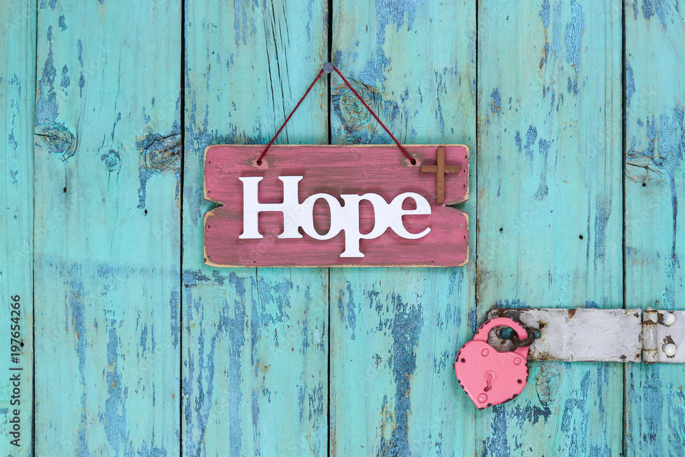 pink-wood-sign-with-the-word-hope-and-a-religious-cross-next-to-heart