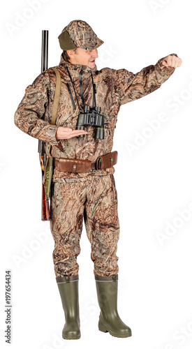Full length portrait of a male hunter with double barreled shotgun Isolated on white 