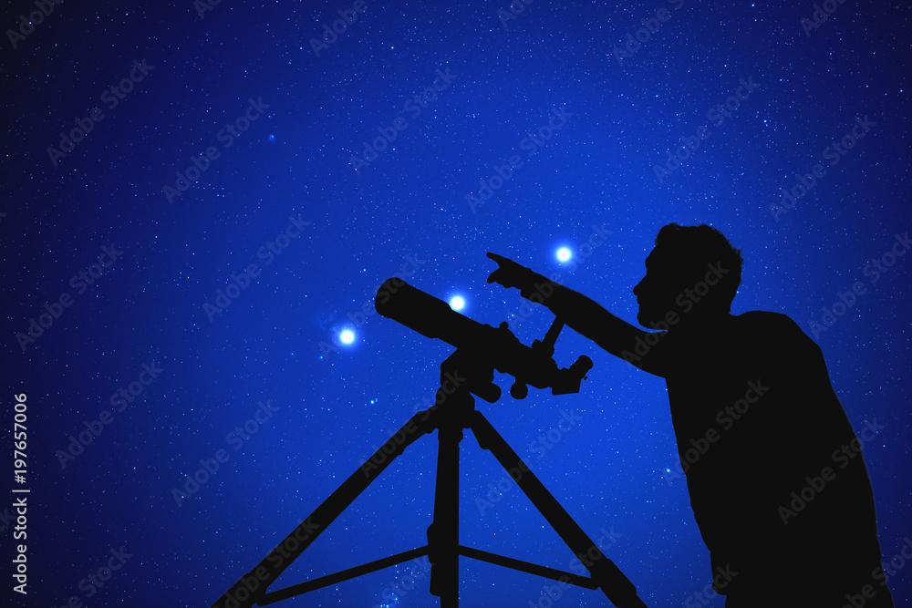 Man with a telescope watching stars. 