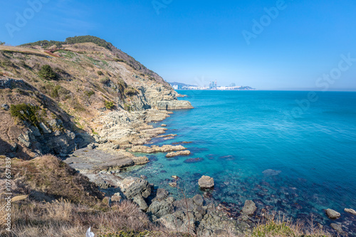 View of Igidae park coastline and Haeundae district from Oryukdo Skywalk in sunny day, Busan, Korea