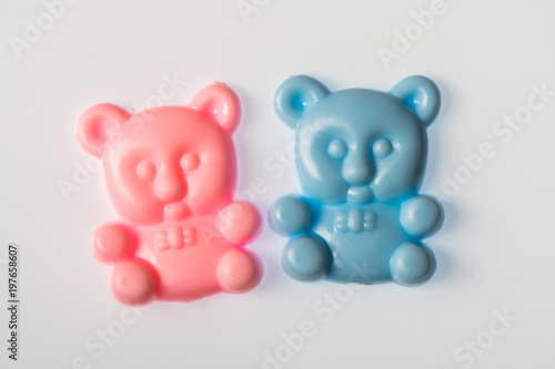 Pink and blue baby toy bears on white background