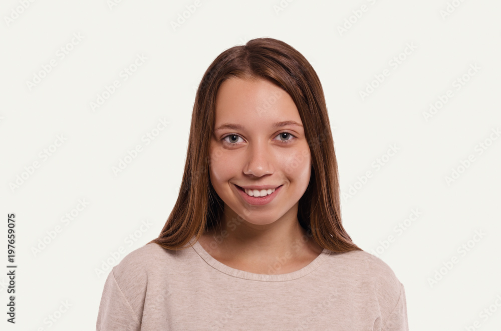 Attractive young girl portrait. Beautiful female looking at camera. Healthy woman studio portrait. Attractive young girl portrait. Beautiful female looking at camera. Healthy woman studio portrait.