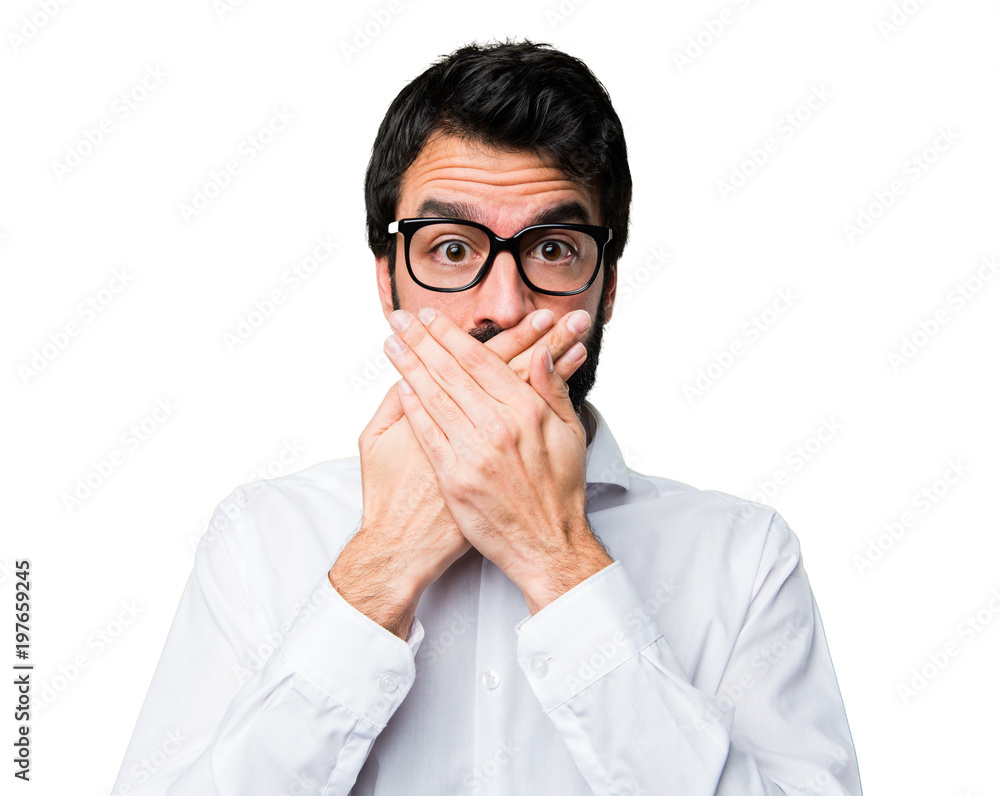 Handsome man with glasses covering his mouth Handsome man with glasses covering his mouth
