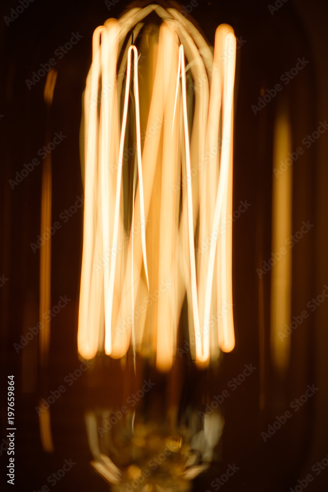 Fototapeta premium Incandescent spiral retro vintage warm lamp edison
