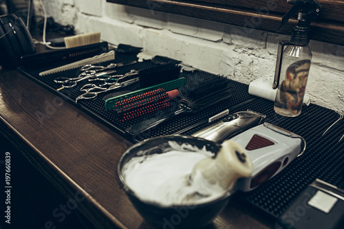 Barber shop tools on the table. Close up view shaving foam. photo