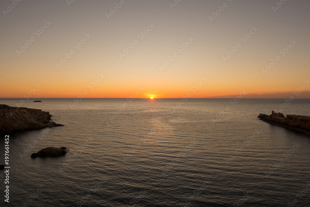 Sunrise at the Cala Sa Punta in Ibiza