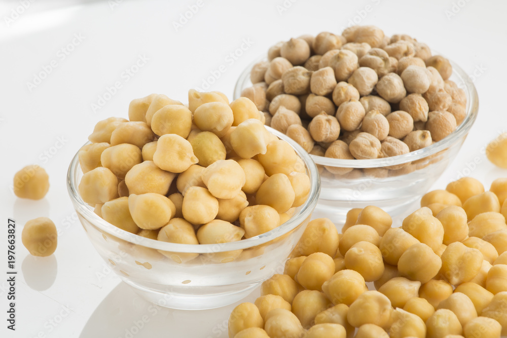 Chickpea grains (Cicer arietinum) in bowl isolated on white background Chickpea grains (Cicer arietinum) in bowl isolated on white background