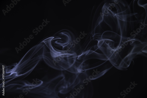 Smoke of a cigarette, on a black background