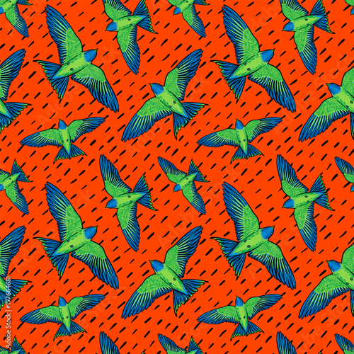 Vivid Birds seamless pattern. Colorful texture with green parrots on orange b...