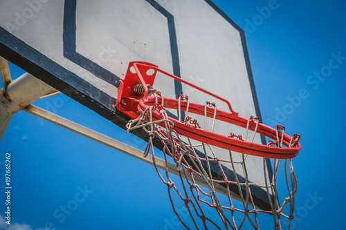 broken basketball hoop - hangig basketball ring closeup photo