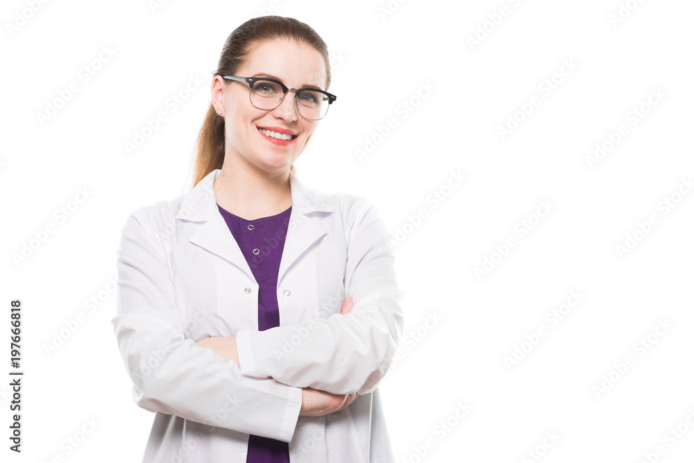 Attractive caucasian brunette female doctor standing in office smiling with crossed arms