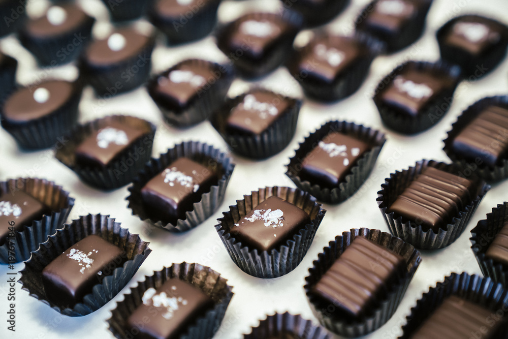 High angle view of chocolates arranged on table at factory High angle view of chocolates arranged on table at factory