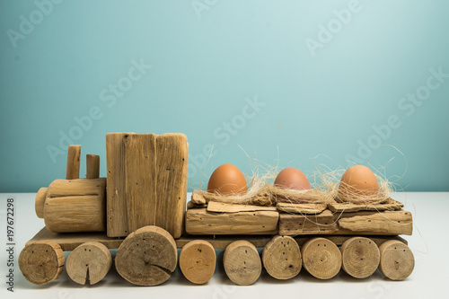 Wooden train toy caring eggs for Easter