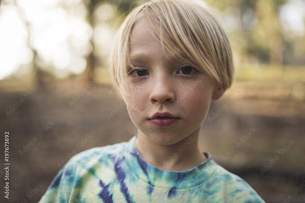 Portrait of boy standing in park Portrait of boy standing in park