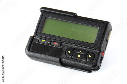 Old beeper or pager isolated on white background , Gadget for communication device photo
