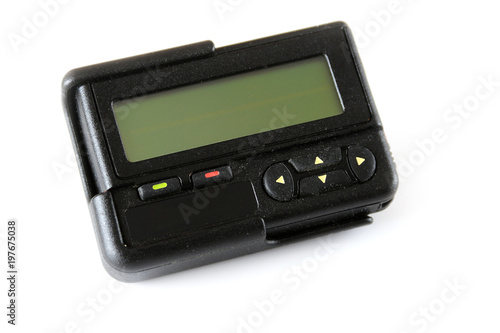 Black old pager isolated on white background , Vintage gadget for communication device photo
