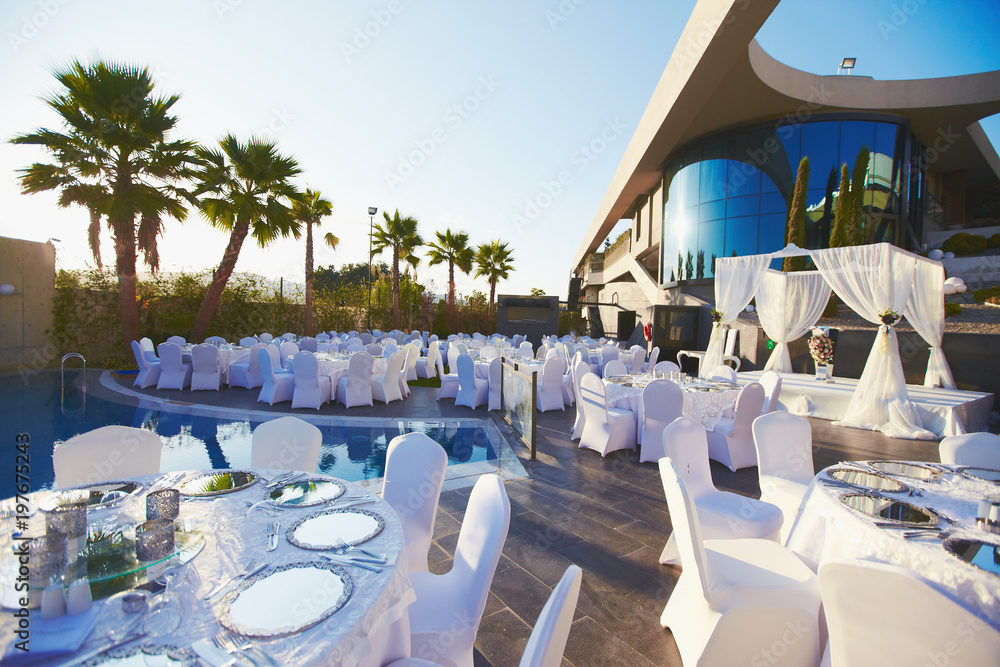 Luxury wedding decorated round tables