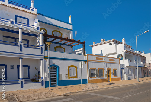 Houses on the seafront in the fishing village of Santa Lucia de Tavira, Portugal
