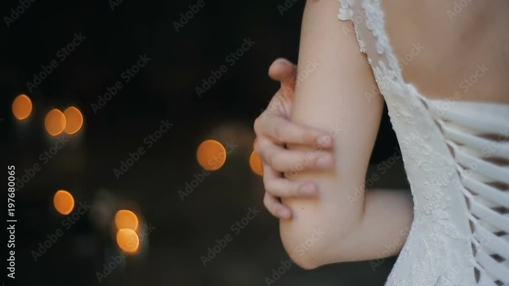 Hand of the groom gently touching the hand of the bride. Wedding couple holding hands, happy groom and bride. Young couple in love bride and groom, wedding day in summer. Hand of the groom gently touching the hand of the bride. Wedding couple holding hands, happy groom and bride. Young couple in love bride and groom, wedding day in summer.