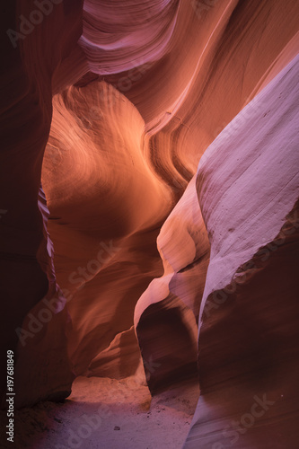 Defused light is revealing texture in the rock walls in a Nothern Arizona slot canyon.