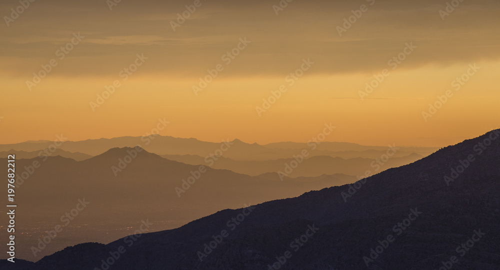 An Arizona sunset showing distant mountain ranges.