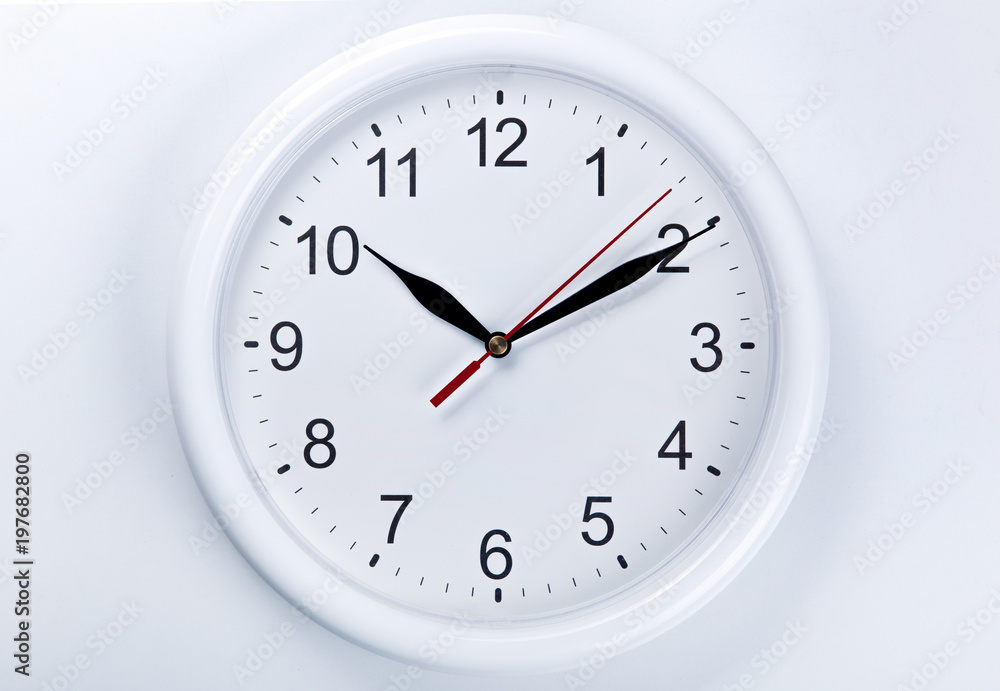big round clock face on a white table closeup big round clock face on a white table closeup
