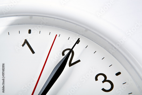 big clock face on a white table closeup