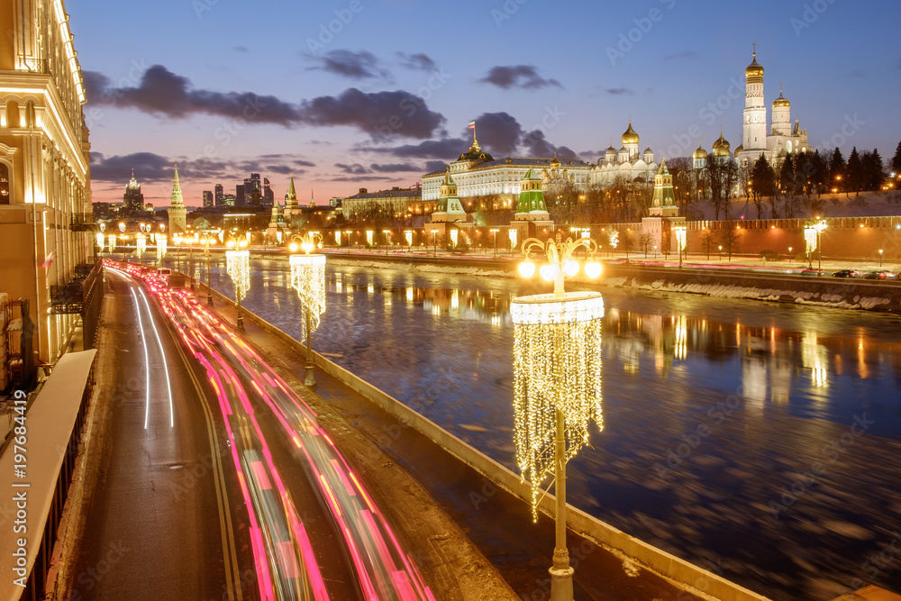 The Moscow Kremlin, a traffic jam, a frozen river, winter