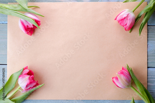 Pink fresh tulips from above, place for inscription