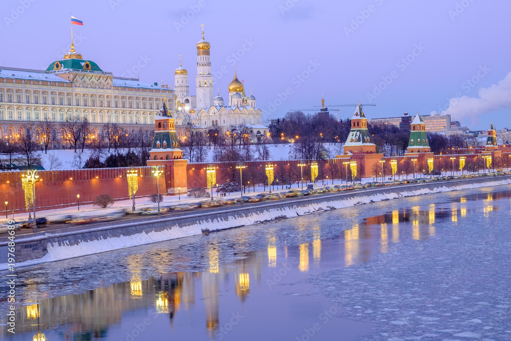 The Kremlin at sunset, a frozen river, ice floes, reflections