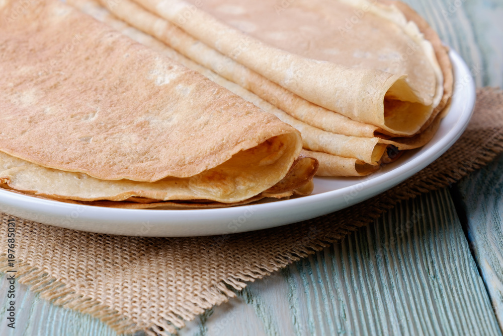 Dish with pancakes, side view