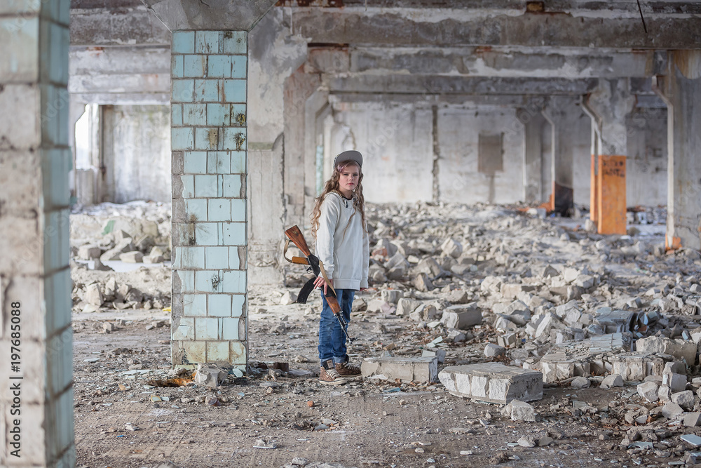 a little girl alone in an abandoned and ruined building with a Kalashnikov assault rifle and arms making her way to survive
