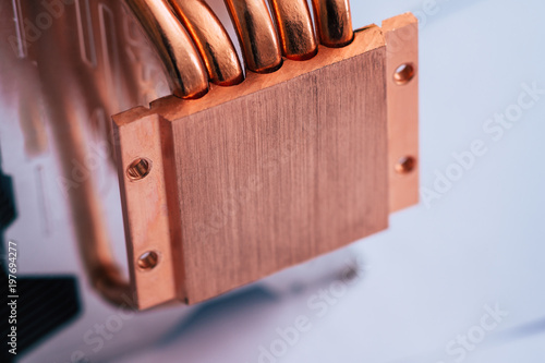 Concept of air cooling of the central processor of a computer Aluminum radiator with copper heat pipe close-up with beautiful bokeh photo