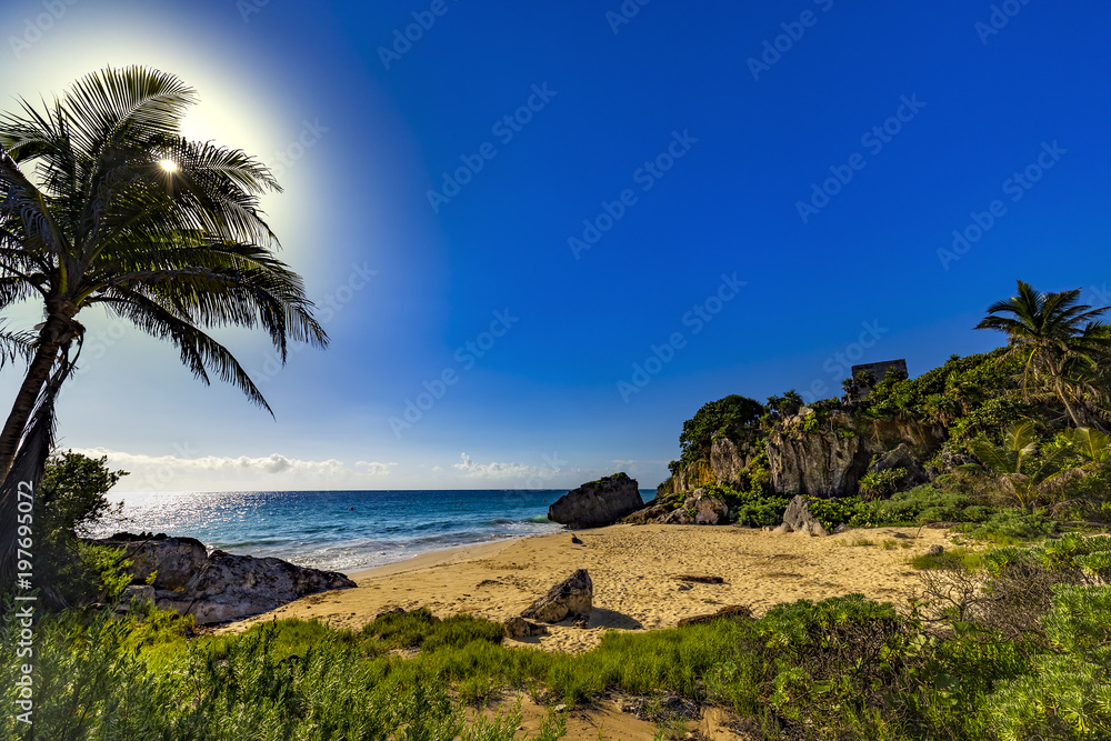 Mexico. The Mayan city of Tulum. There is beach - birthplace of sea turtles, beyond silhouettethe of the Castle Mexico. The Mayan city of Tulum. There is beach - birthplace of sea turtles, beyond silhouettethe of the Castle