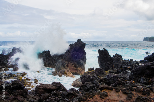 Large Waves Crashing Over Rocks