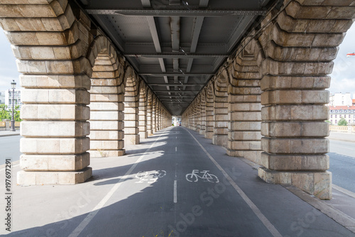 Fototapeta Naklejka Na Ścianę i Meble -  Bicycle lanes, Bike lanes, pedestrian way under railway metro line over 