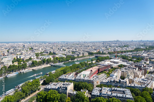 View of skyline Paris from top view. Cityscape of Paris from Eifel tower.  Cityscape and Seine river from top view at Eifel tower.  © Peeradontax
