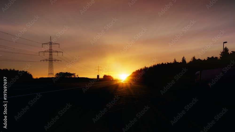 Sunset Strip . Sunset road . Dramatic nature background .  Sunset or sunrise with clouds, light rays and other atmospheric effect . Light from sky  . 