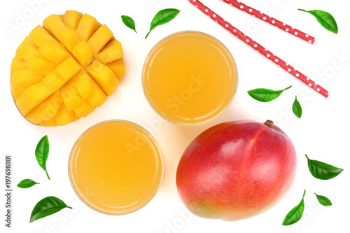 Mango juice and fruit decorated with leaves isolated on white background close-up. Top view. Flat lay