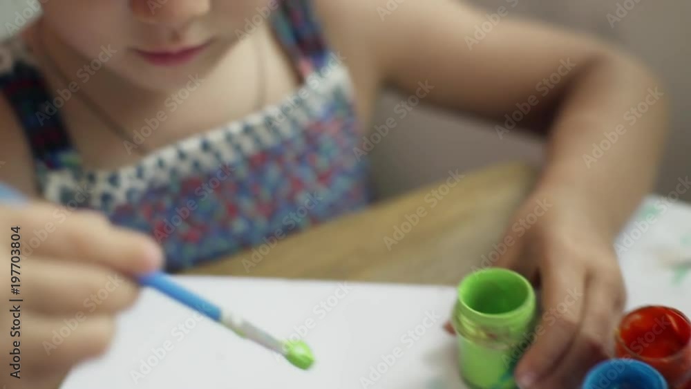 Close up girl drawing with colored dyes at sunny cafe rapid slow motion Close up girl drawing with colored dyes at sunny cafe rapid slow motion