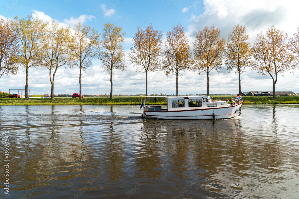 Small boat sailing on the canal Small boat sailing on the canal