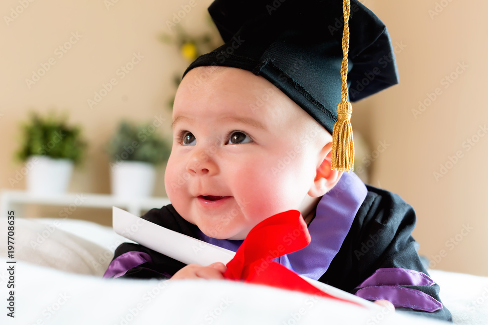 Little baby girl in graduation cap and gown Stock Photo | Adobe Stock