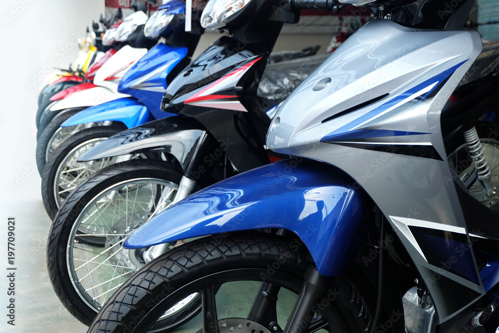Many colorful motorcycles at the Showroom for sale