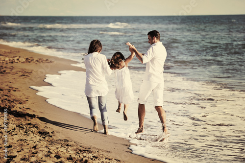 happy young family have fun on beach