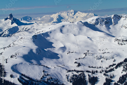 A winter wonderland landscape view of Whistler Mountain with great skiing terrain.  Black Tush can also be seen and the tantalus range in the background