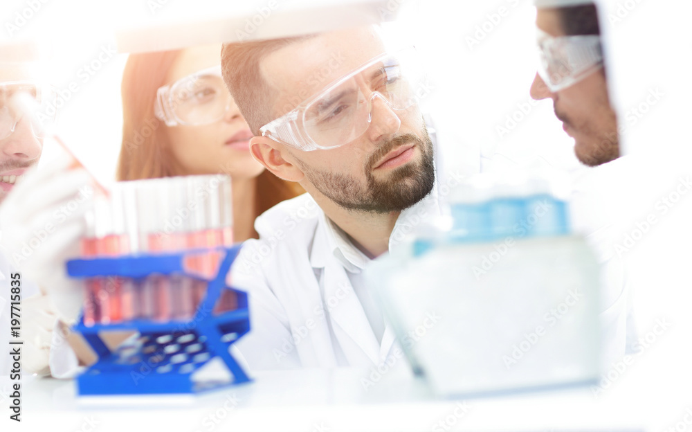 closeup of a group of scientists and pharmacists in the laborato closeup of a group of scientists and pharmacists in the laborato